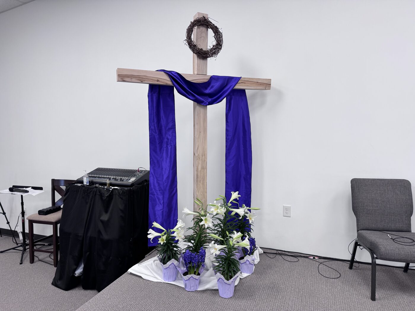 The pulpit and wooden cross at Hi-Point Free Will Baptist Church